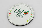 Posavasos redondo blanco con marca Chef Fruit y frutas a color.