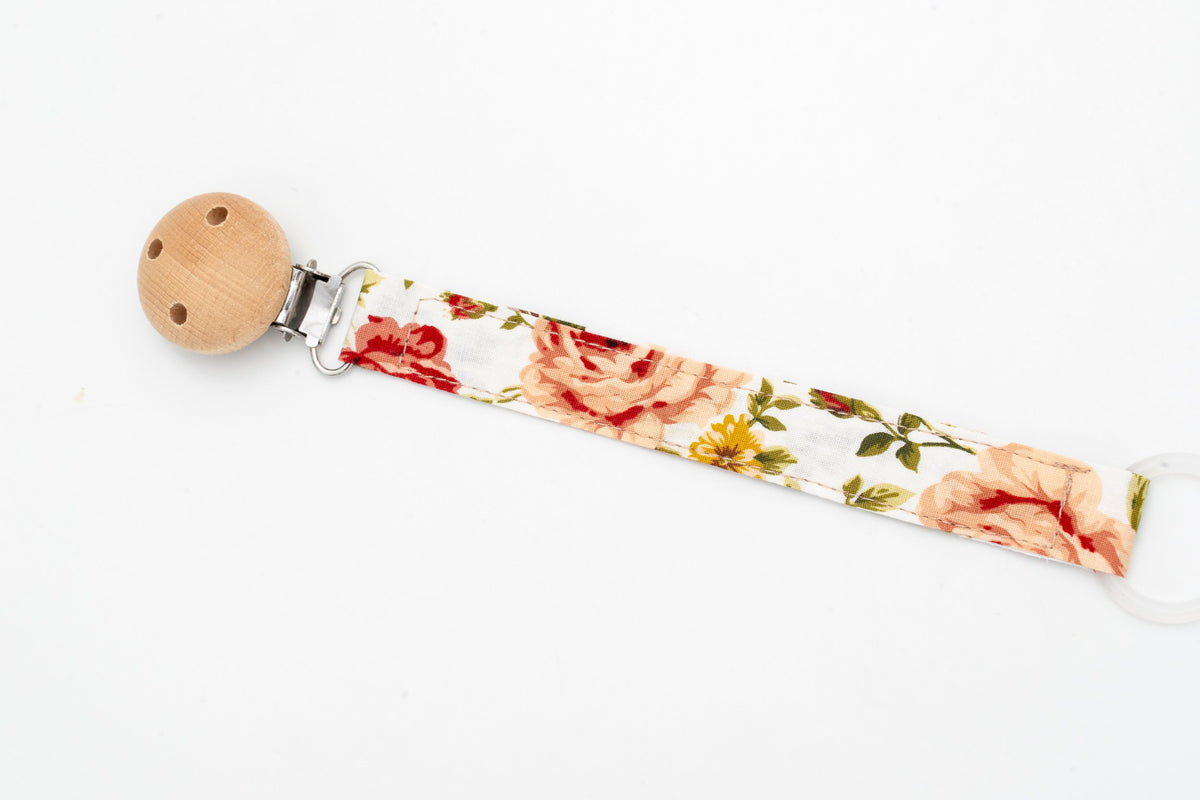 Portaxumets de tela amb estampat de roses vintage i clip rodó de fusta