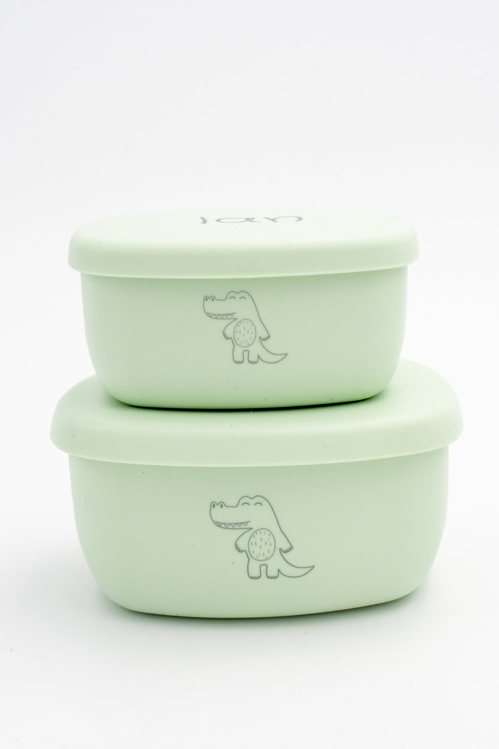 Dos tuppers verde claro apilados con dibujos grabados